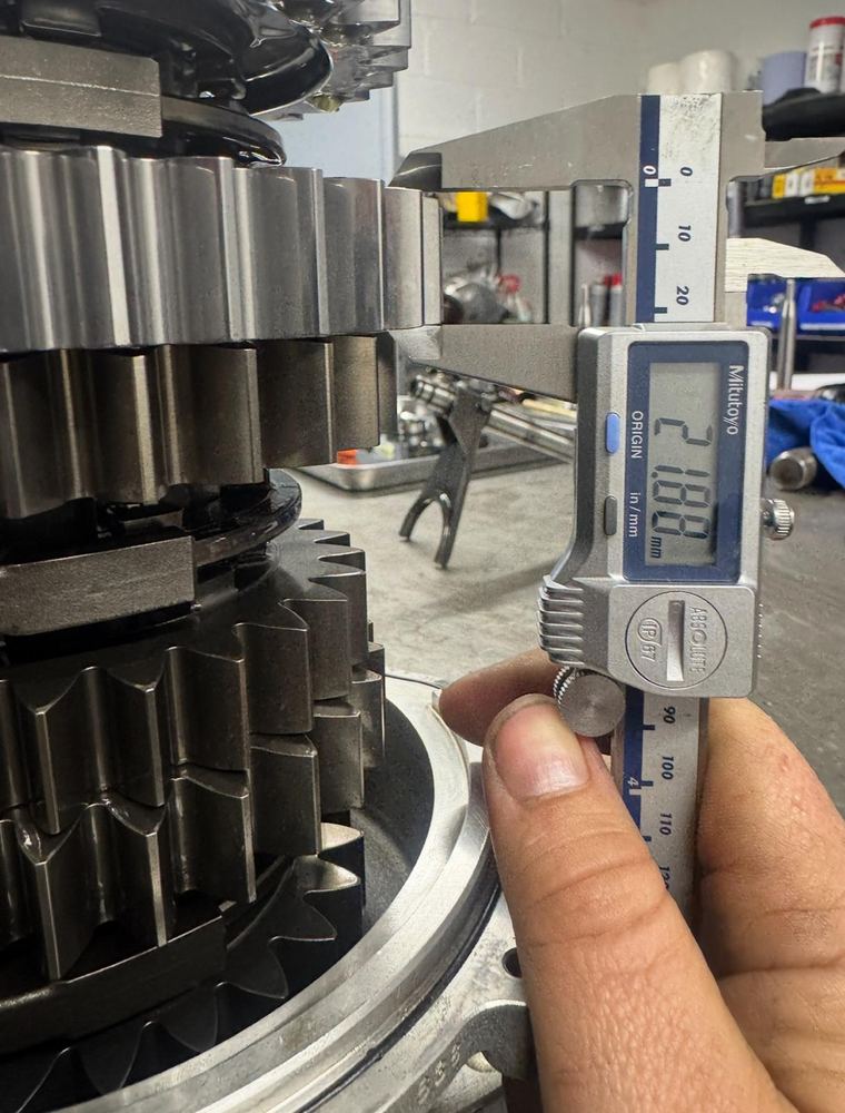 Precision measurement during gearbox inspection.