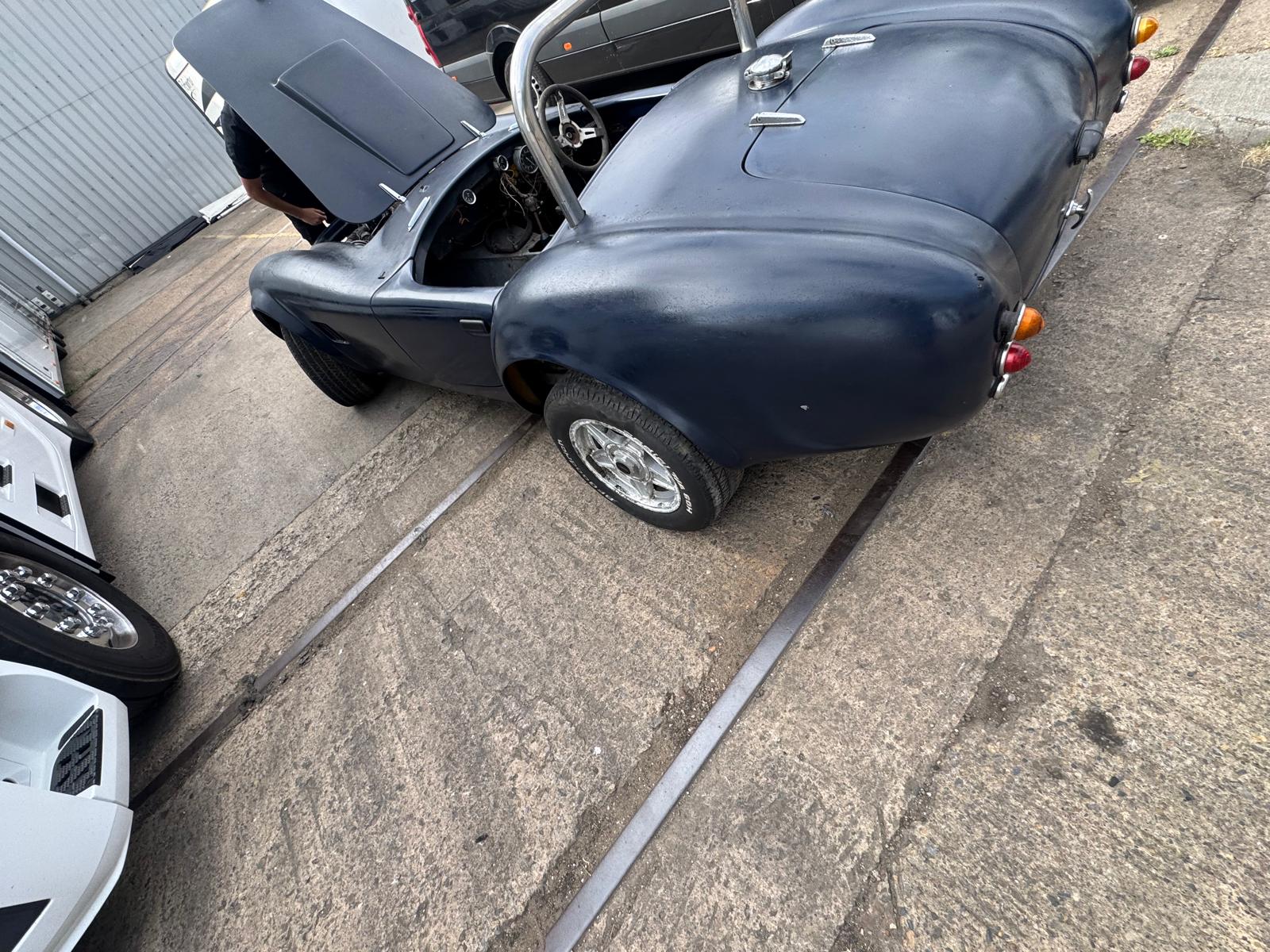 Rear three-quarter view before further dismantling and rebuild work.