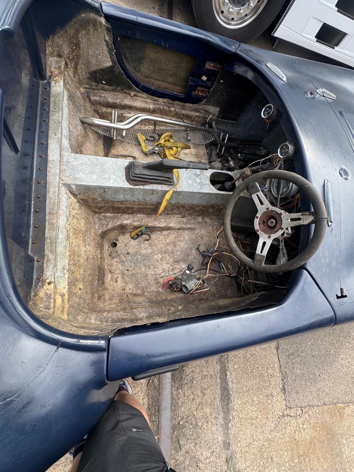 Stripped cockpit showing the condition of the interior and wiring.